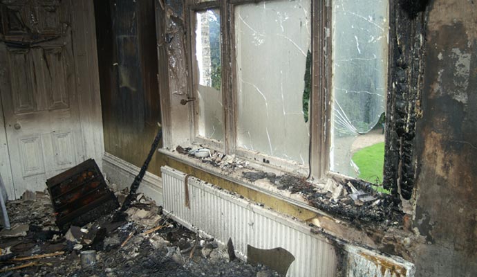 home fire damage broken window glass